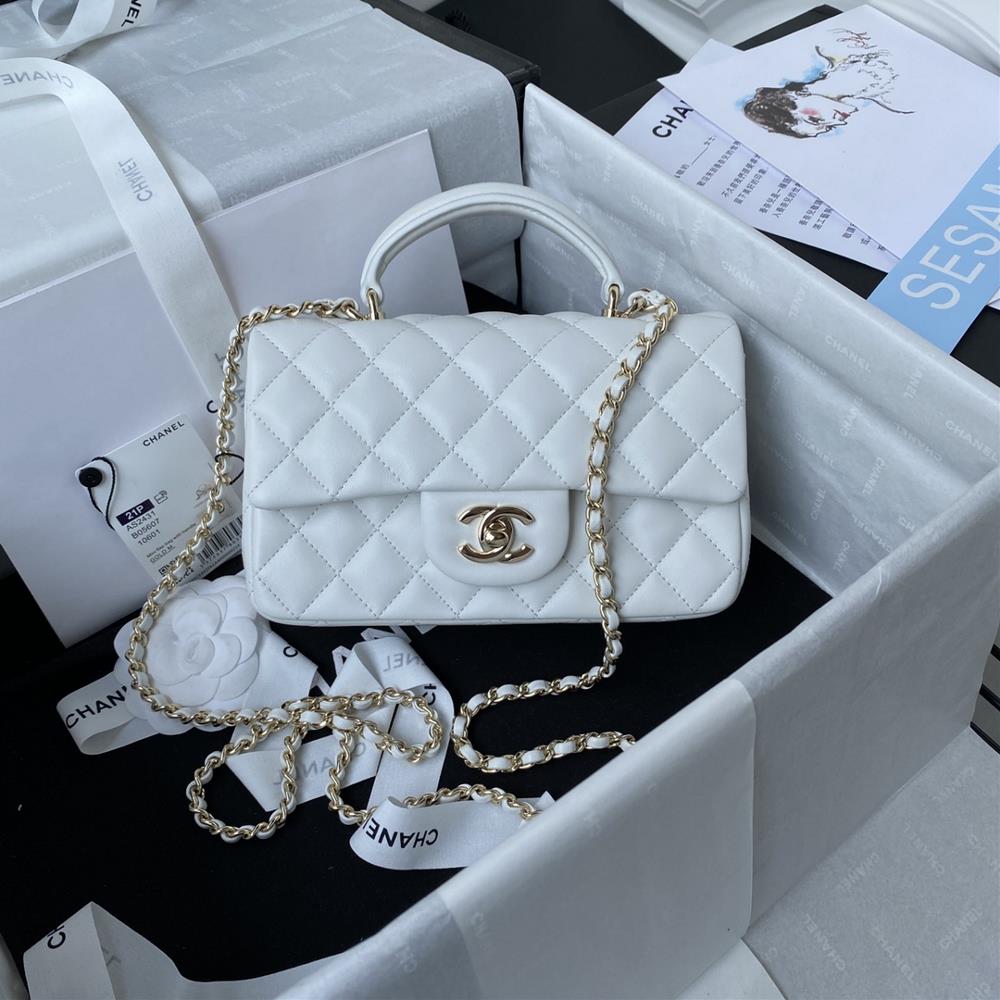 The latest Mini CF handle handbag AS2431 from Chanel 21K in light gold features a classic diamond grille lid bag with a head hanging decoration It is