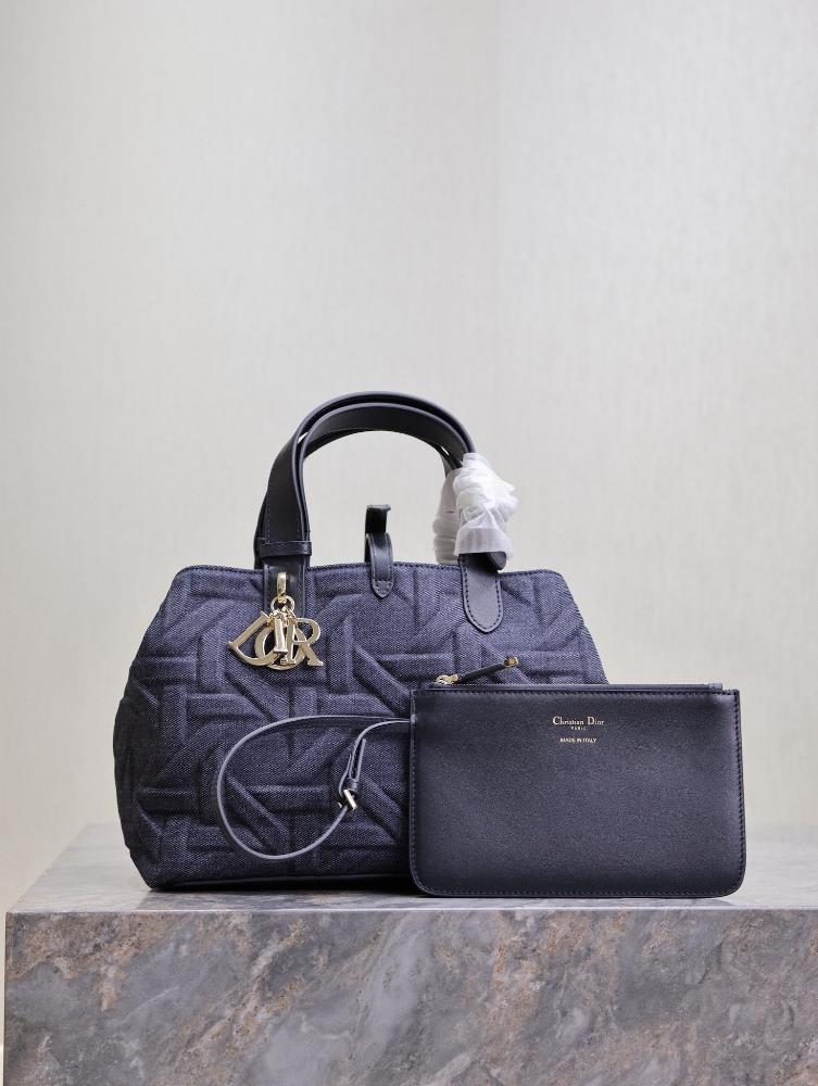 Medium size Dior Toujours handbag denim pressed rattan gridThis Dior Toujours handbag is casual practical and unique Crafted with blue denim fabric