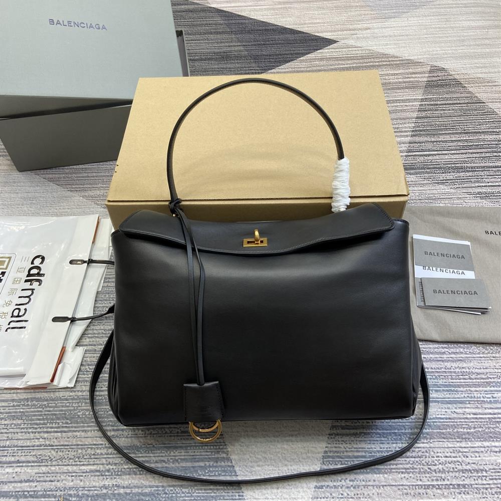 0 Balenciaga has shipped outRodeo black handbag with vintage gold metal accessories inspired by a lot of dystopian coolness and vintage effects feat