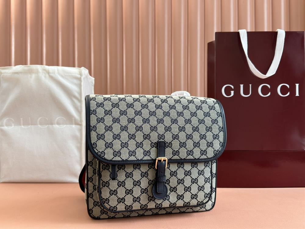 GG canvas mailman bagThe classic striped ribbon continues to add color to Guccis childrens clothing collection The details of the logo complement t