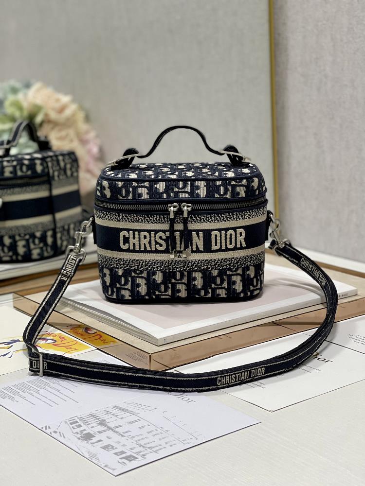 Crossbody blue D makeup bag with CHRISTIAN DIOR logo on the front Paired with detachable and adjustable embroidered shoulder straps in the same color