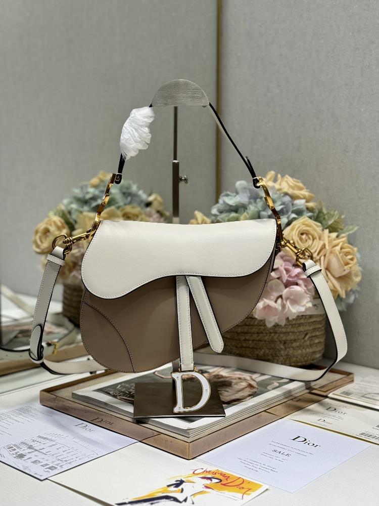 Dior Saddle Bag Color blocked with Shoulder Strap Apricot and WhiteThis classic saddle bag highlights Maria Grazia Chiuris clever and innovative desi