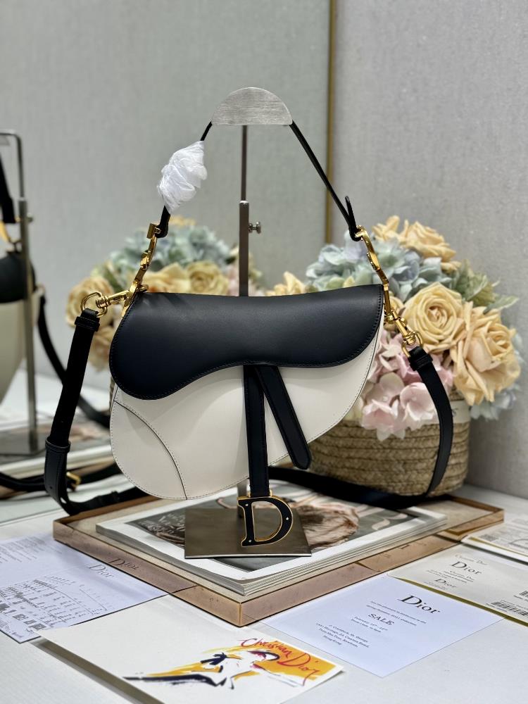 Dior Saddle Bag Color blocked with Shoulder Strap White and BlackThis classic saddle bag highlights Maria Grazia Chiuris clever and innovative design