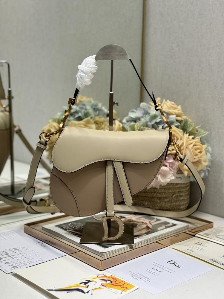 Dior Saddle Bag Color blocked with Shoulder Strap Apricot and SandThis classic saddle bag highlights Maria Grazia Chiuris clever and innovative desig