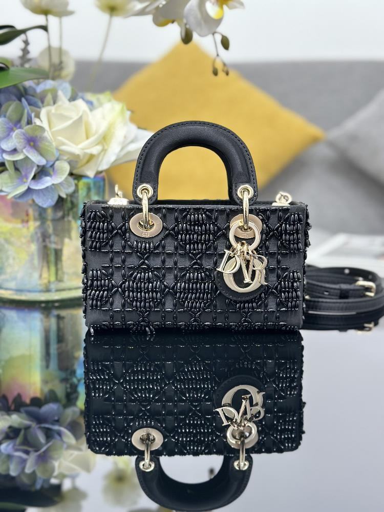 Lady DJoys ultra mini embroidered diamond shaped black beads highlight the minimalist aesthetics of the Lady Dior collection embodying Diors profou