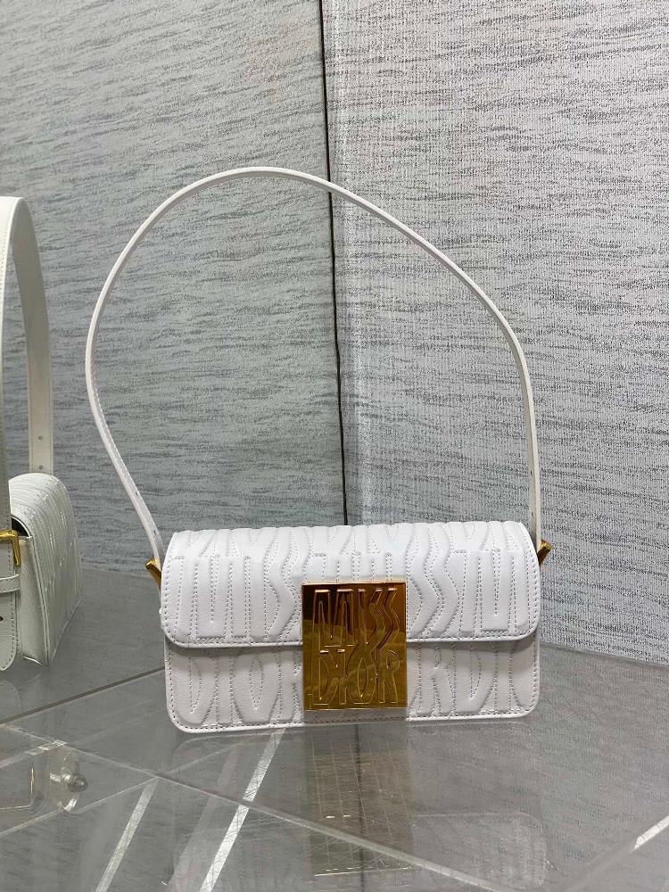 Miss Dior Flip up HandbagThis Miss Dio r flip up handbag is a new addition to the 2024 winter ready to wear collection reinterpreting the modern an