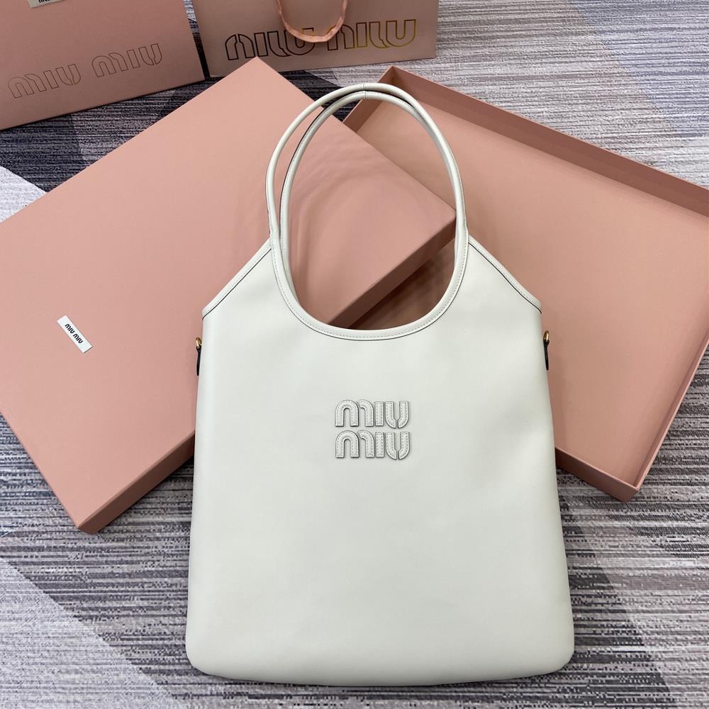 Comes with a full set of packaging Miu womens IVY cowhide tote shoulder bagThis classic tote bag is adorned with the Miu Miu logo showcasing a class