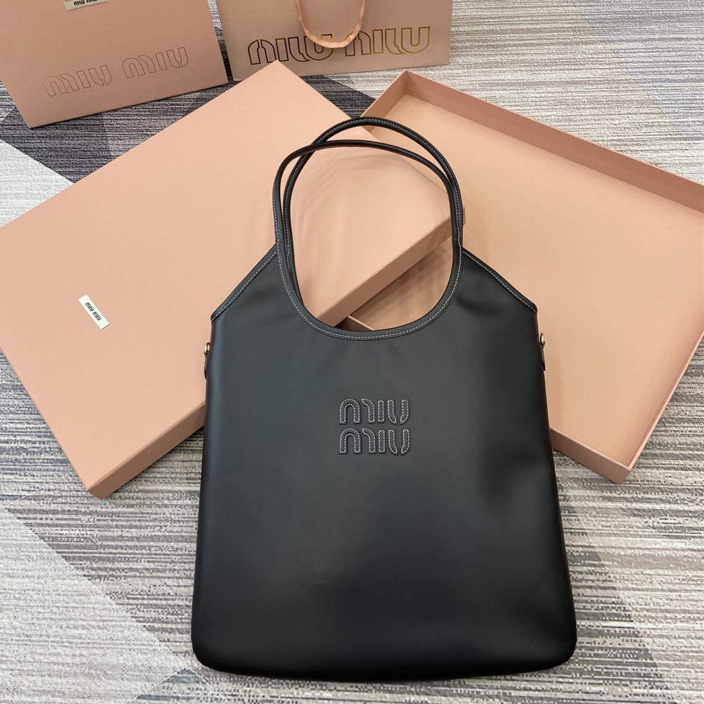 Comes with a full set of packaging Miu womens IVY cowhide tote shoulder bagThis classic tote bag is adorned with the Miu Miu logo showcasing a class