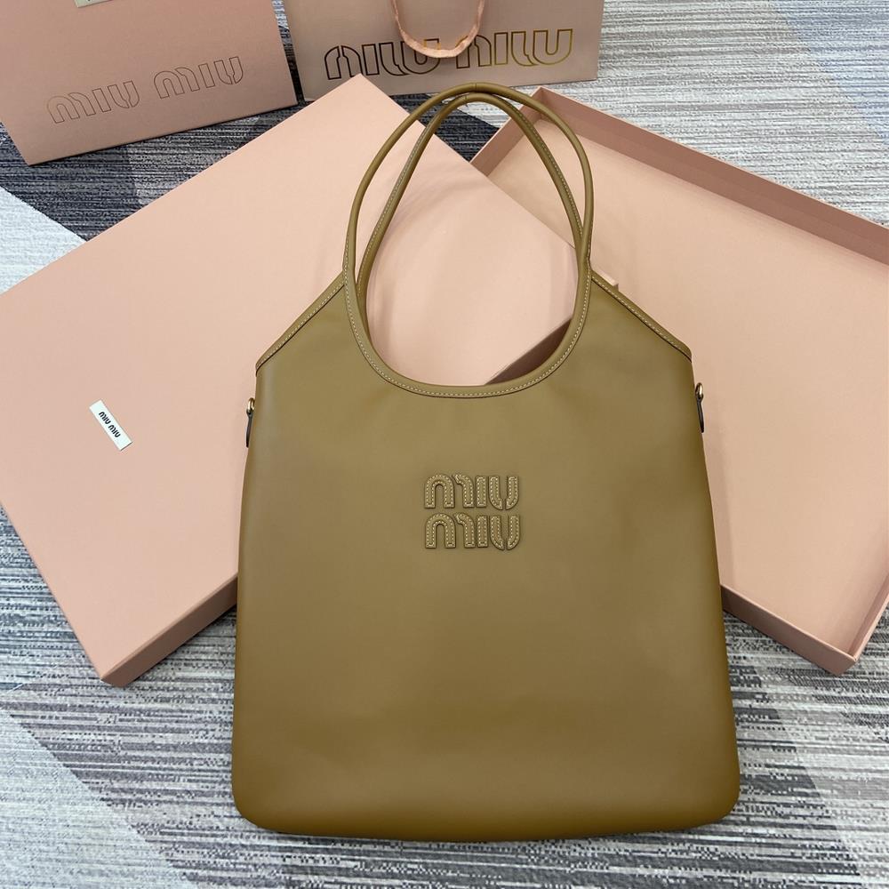 Comes with a full set of packaging Miu womens IVY cowhide tote shoulder bagThis classic tote bag is adorned with the Miu Miu logo showcasing a class