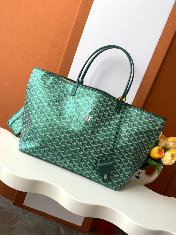 As a limited edition for 2024 the handbag features a unique pearl colored GOYARDINE canvas with a rainbow like shimmering effect This exclusive limi