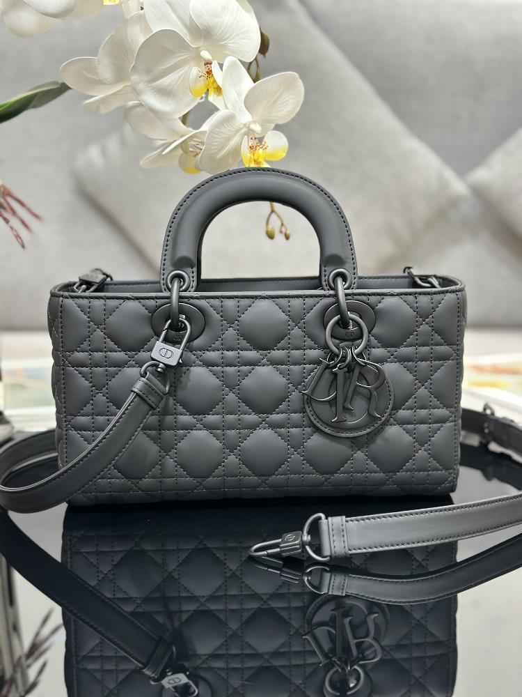 The Lady DJoy mediumsized horizontal grid frosted handbag highlights the minimalist aesthetics of the Lady Dior collection embodying Diors profound