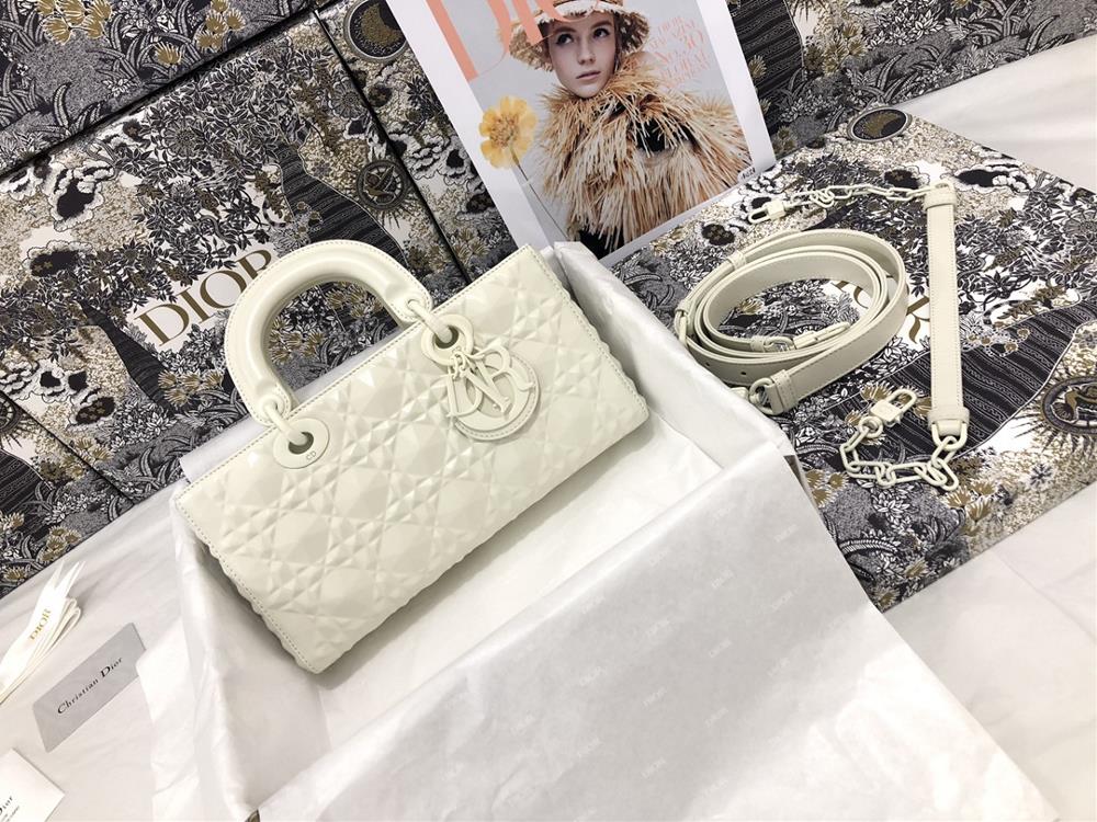 The Lady DJoy horizontal diamond patterned white handbag highlights the iconic minimalist aesthetic of the Lady Dior collection embodying Diors prof