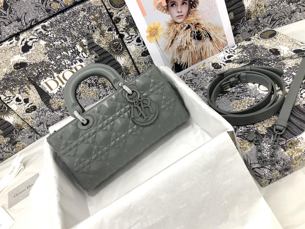 The Lady DJoy horizontal diamond patterned gray handbag highlights the iconic minimalist aesthetic of the Lady Dior collection embodying Diors profo