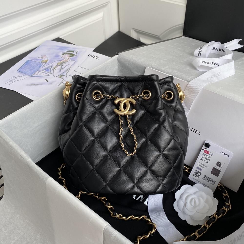 The Chanel vintage drawstring button bag AS2057 features the classic diamond grid pattern and leather chain design commonly seen by Chanel The workma