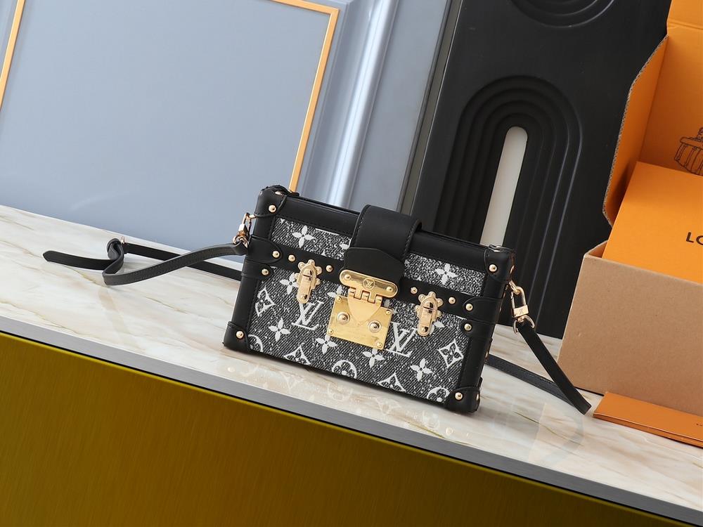 The upgraded original M21462 M86286 black denim Petite Malle handbag is made of Monogram jacquard denim fabric showcasing the new season look of Loui