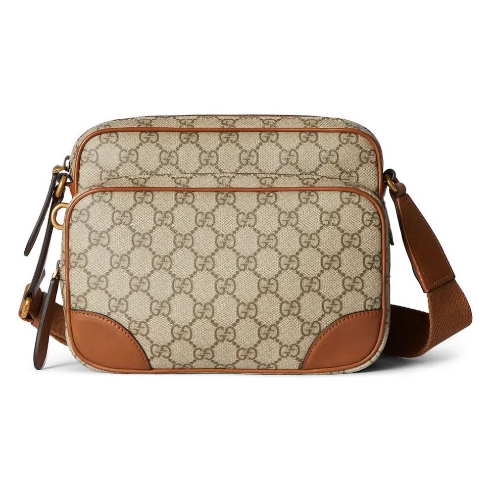 The allnew GG Emblem series of mens travel items reinterpret the brands timeless elegance and exquisite craftsmanship This crossbody bag is crafte