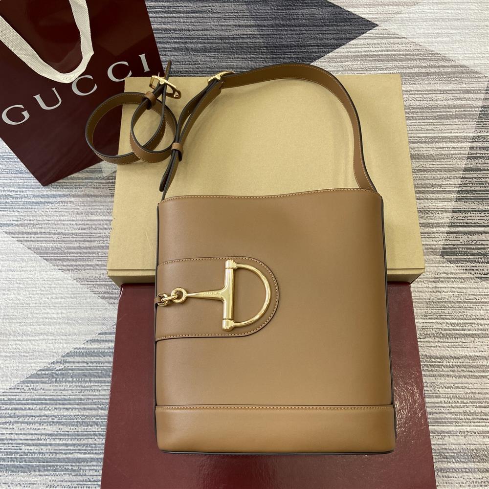 In the 2025 SpringSummer collection Gucci 73 is inspired by the archive bucket bag from the same year It adopts a contemporary horseshoe buckle har