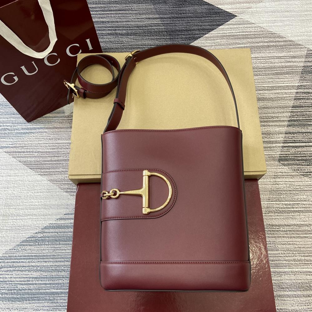 In the 2025 SpringSummer collection Gucci 73 is inspired by the archive bucket bag from the same year It adopts a contemporary horseshoe buckle har