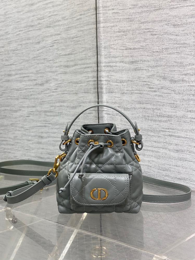 Micro Dior Caro Bucket BagThis miniature Dior Caro bucket bag is a new product in the 20225 autumn ready to wear collection showcasing a fashionabl