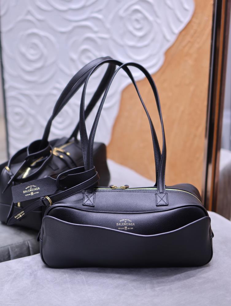 Paris Family CARRIE Small Bowling Bag BlackBalenciaga deconstructs traditional frameworks with avantgarde aesthetics constantly breaking through the
