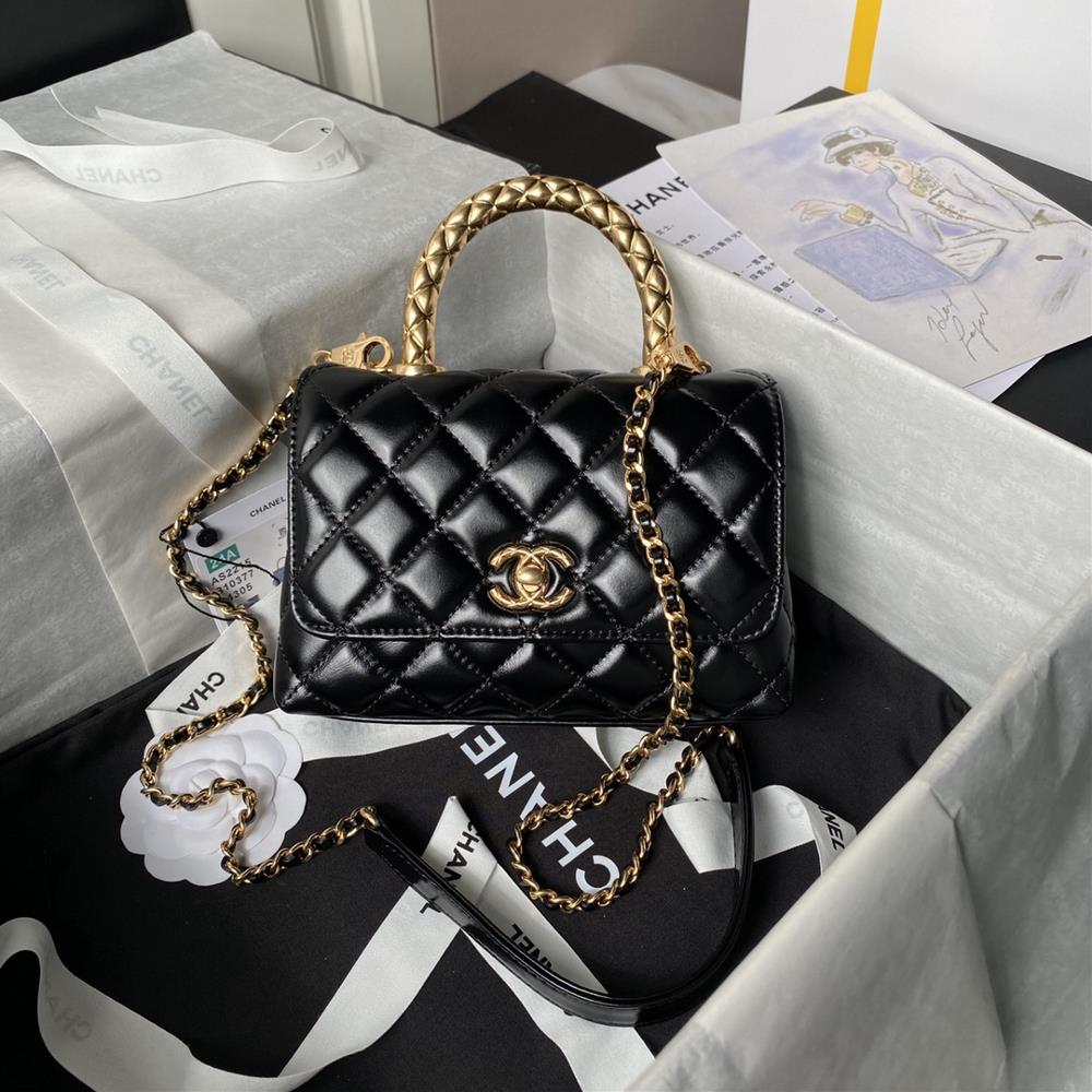 The Chanel 24a handmade visit series hit 2215 cocohandle classic features a glossy cowhide metal handle design with a shimmering golden light exuding
