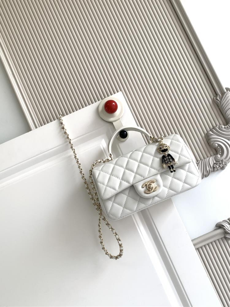 The latest 21K Mini CF handle handbag AS2431 features a classic diamond grille lid bag with a human head hanging decoration The exquisite classic cha