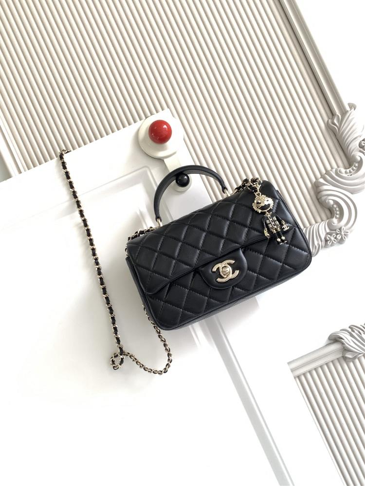 The latest 21K Mini CF handle handbag AS2431 features a classic diamond grille lid bag with a human head hanging decoration The exquisite classic cha
