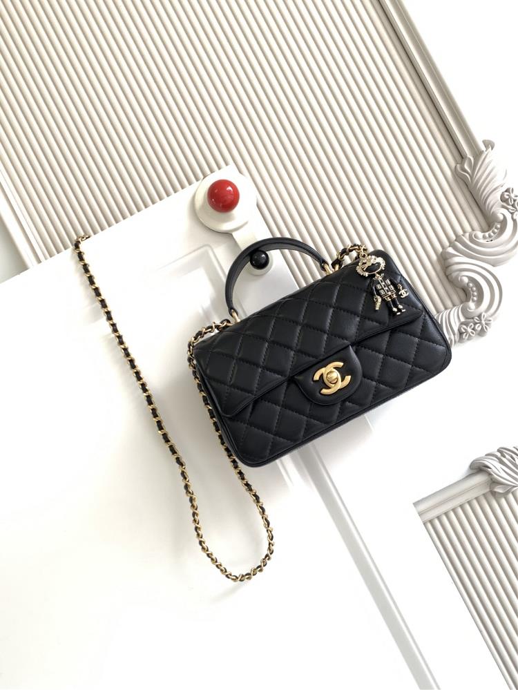 The latest 21K Mini CF handle handbag AS2431 features a classic diamond grille lid bag with a human head hanging decoration The exquisite classic cha