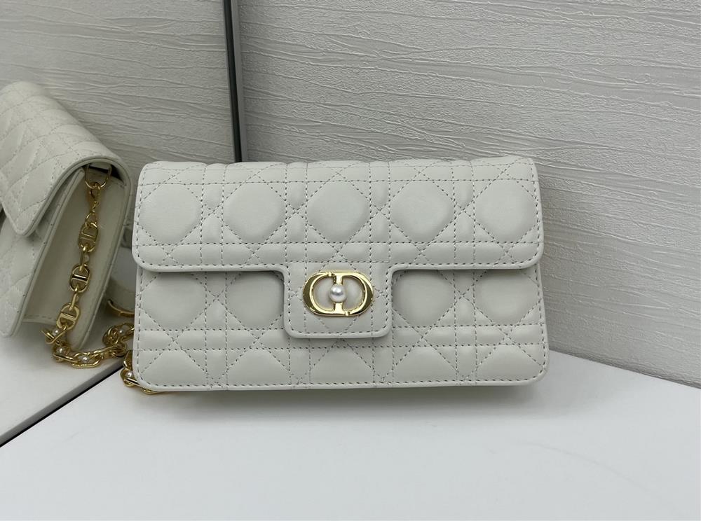 This Dior Jolie mini chain handbag is a new addition to the FallWinter 2025 ready to wear collection combining elegance and practicality Crafted wi