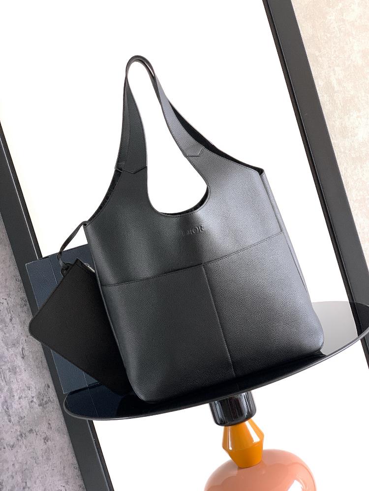 This Dior Priv handbag is a new addition to the fall 2025 mens clothing collection exquisite and elegant Crafted with black Dior Icons cowhide the