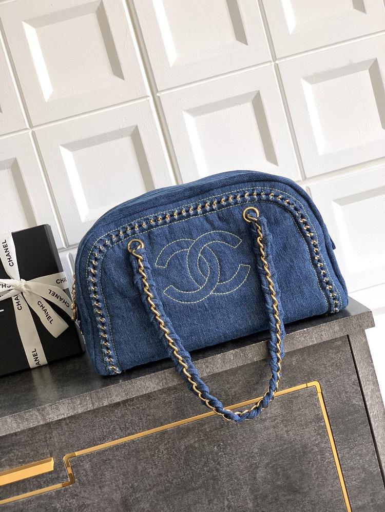 The gold buckle OHANEL denim bag meets the classic with a bag collar trend The Boston bowling bag has a clever cylindrical shape which can hold all
