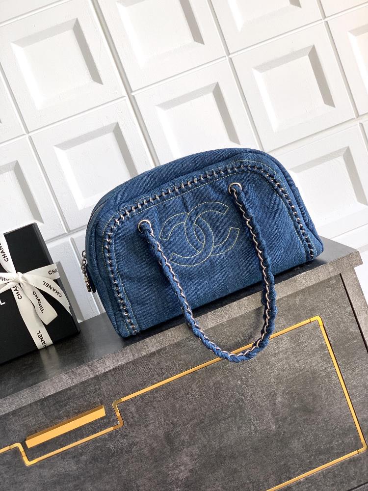 The silver buckle OHANEL denim bag meets the classic with a bag collar trend The Boston bowling bag has a clever cylindrical shape which can hold a