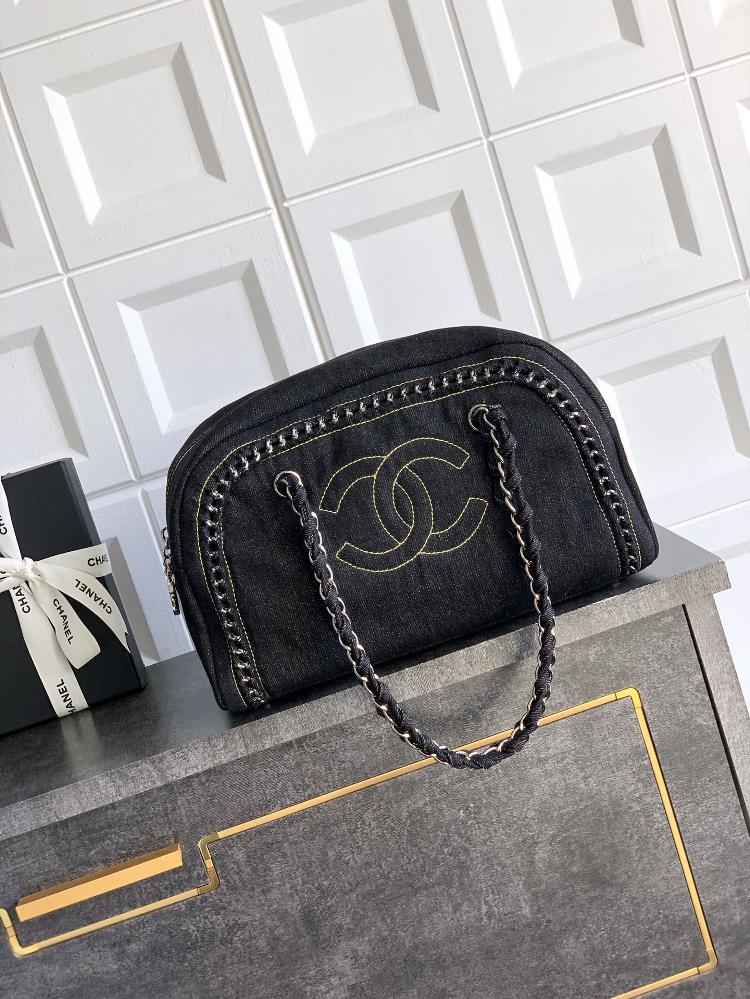 The silver buckle black OHANEL denim bag meets the classic with a bag collar trend The Boston bowling bag has a clever cylindrical shape which can