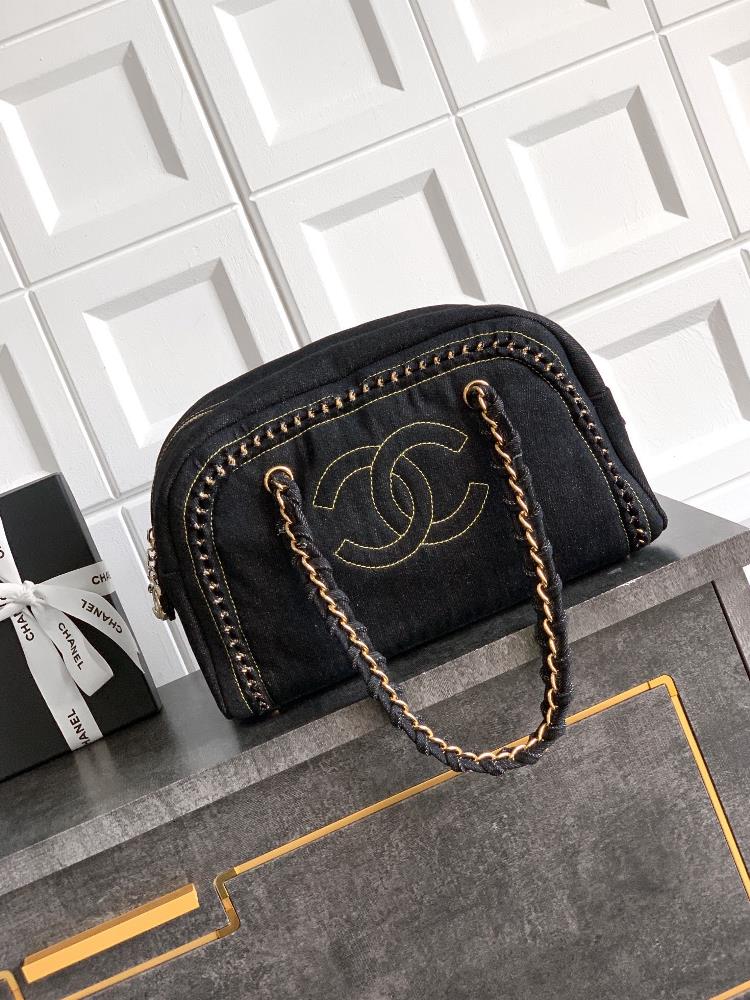 The gold buckle black OHANEL denim bag meets the classic with a bag collar trend The Boston bowling bag has a clever cylindrical shape which can ho