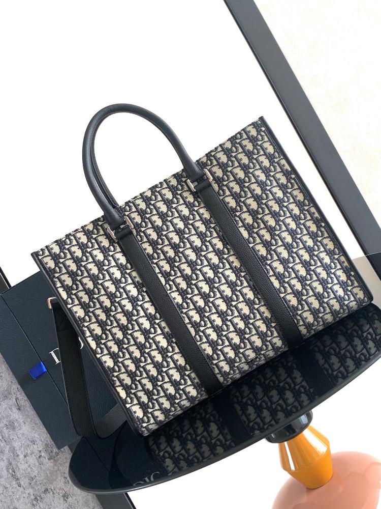 The Dior EastWest handbag showcases a timeless and elegant style Crafted with beige and black Oblique printed fabrics the classic Dior pattern is r